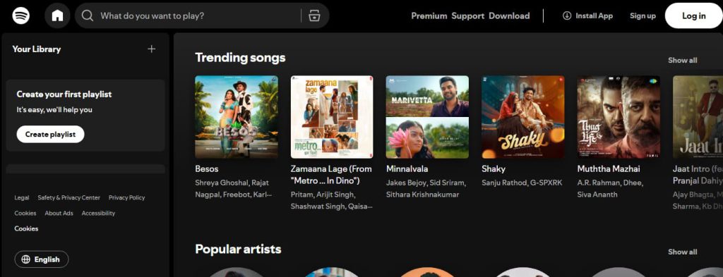 User opening the official Spotify website on a computer and mobile browser to begin redeeming a Spotify gift card online.