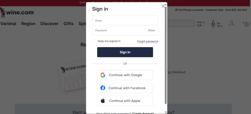 A person logging into their wine gift card account on a laptop or selecting the 'Create Account' option on the official website interface. A person logging into their wine gift card account on a laptop or selecting the 'Create Account' option on the official website interface.