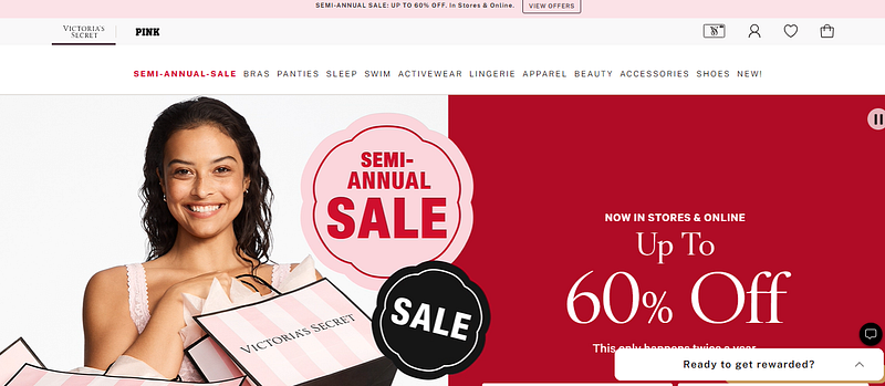 User accessing the official Victoria’s Secret website or mobile app to begin the gift card redemption process.