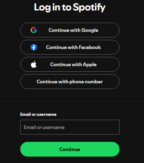 User logging into their Spotify account or signing up for a new account on the official Spotify website to redeem a gift card.