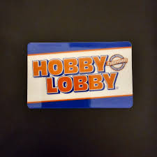 Cashier scanning a Hobby Lobby gift card in-store Cashier scanning a Hobby Lobby gift card in-store